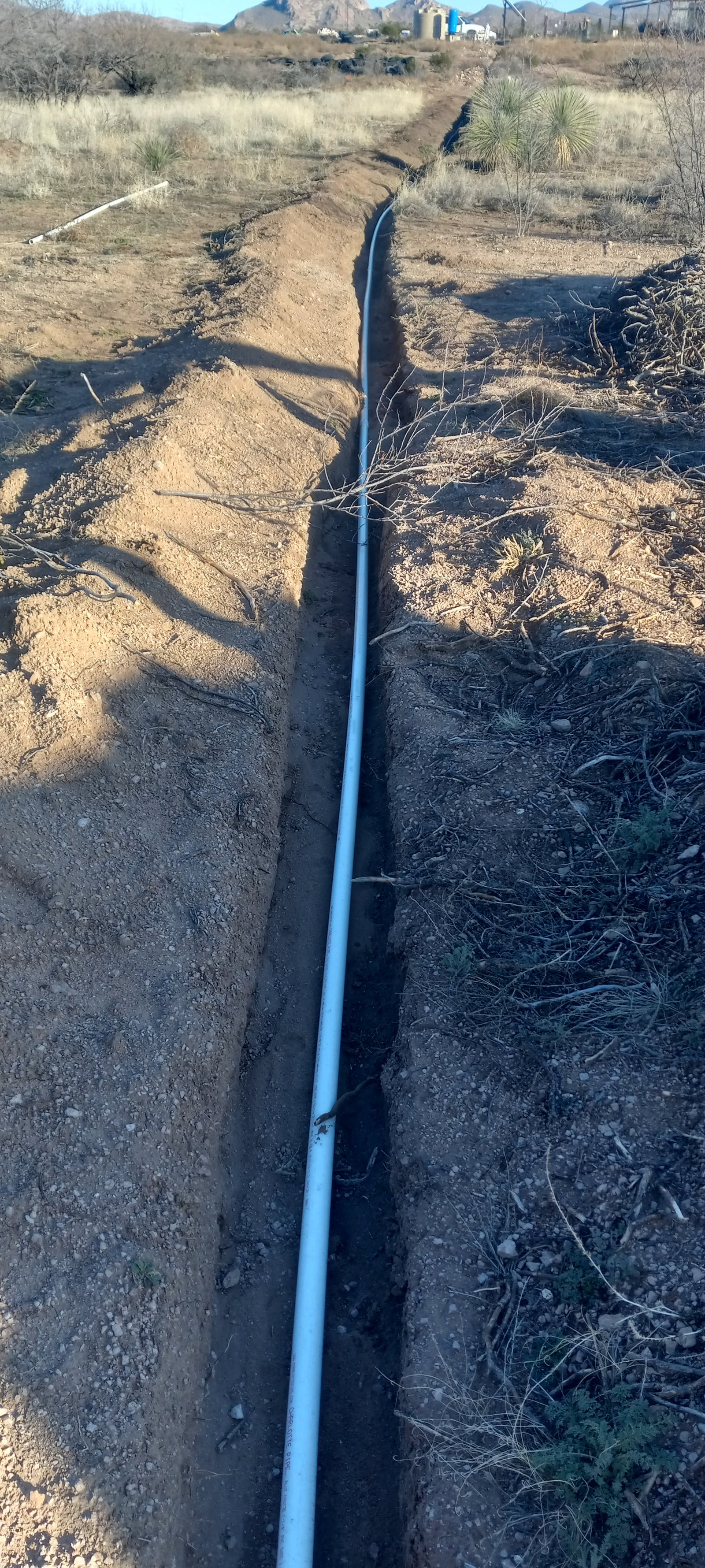Agricultural pipeline installation on the CompostHubOnline ranch.