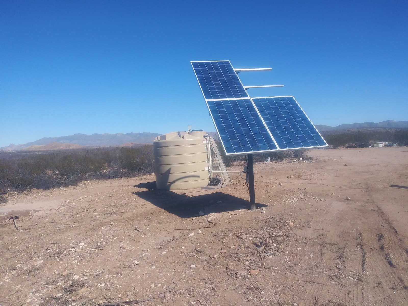 Solar-powered well infrastructure on the CompostHubOnline ranch.